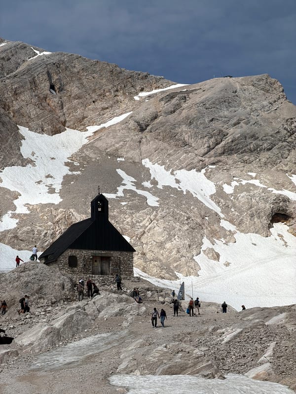 Stone alpine chapel on a snowy Bavarian mountainside