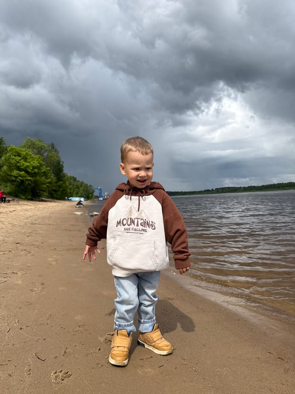 Mother and child enjoy morning outing at Russian lakeside park