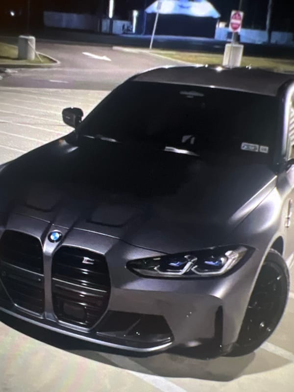 Evening scenes documented in Popovo: parked BMW, restaurant interior