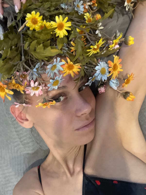 Woman photographed with flowers in braided hair, Yaroslavl'