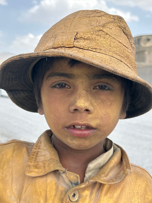 Dust-covered youth photographed on Quetta streets