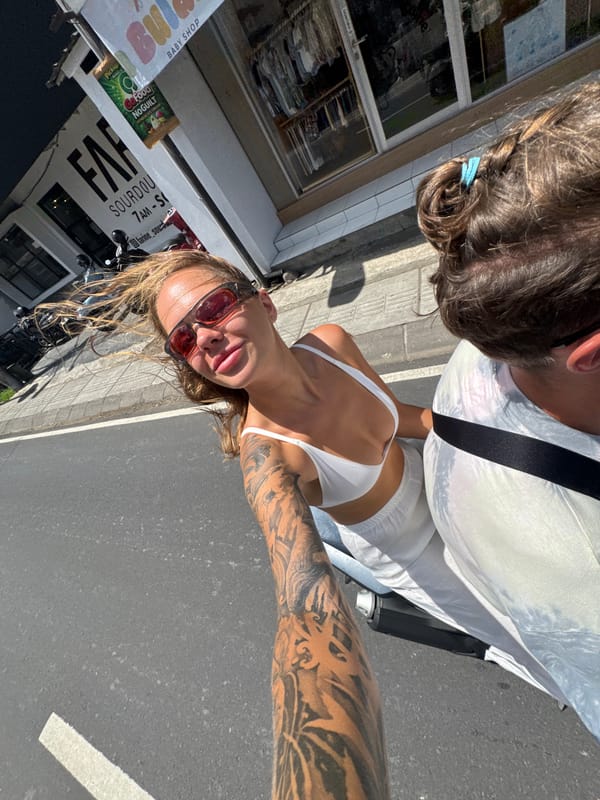 Woman photographed taking selfie on North Kuta street