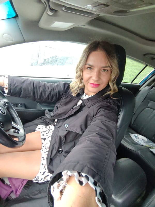Woman Takes Car Selfies in Petropavlovsk-Kamchatsky During Evening Hours