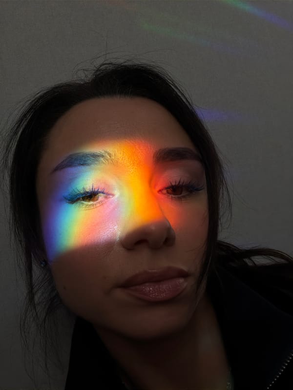 Person experiments with prism light effects in Saint Petersburg apartment