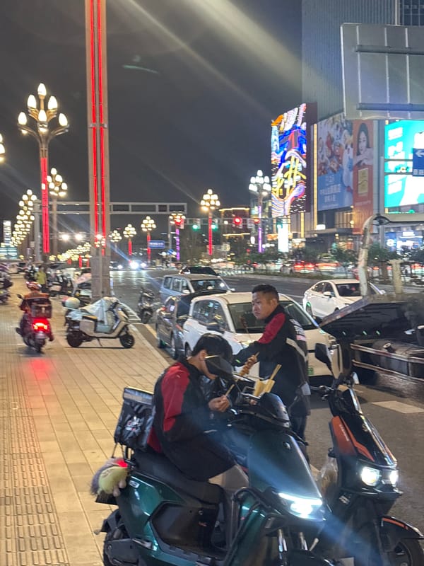 Street food scene captured in nighttime Liangjiang, China