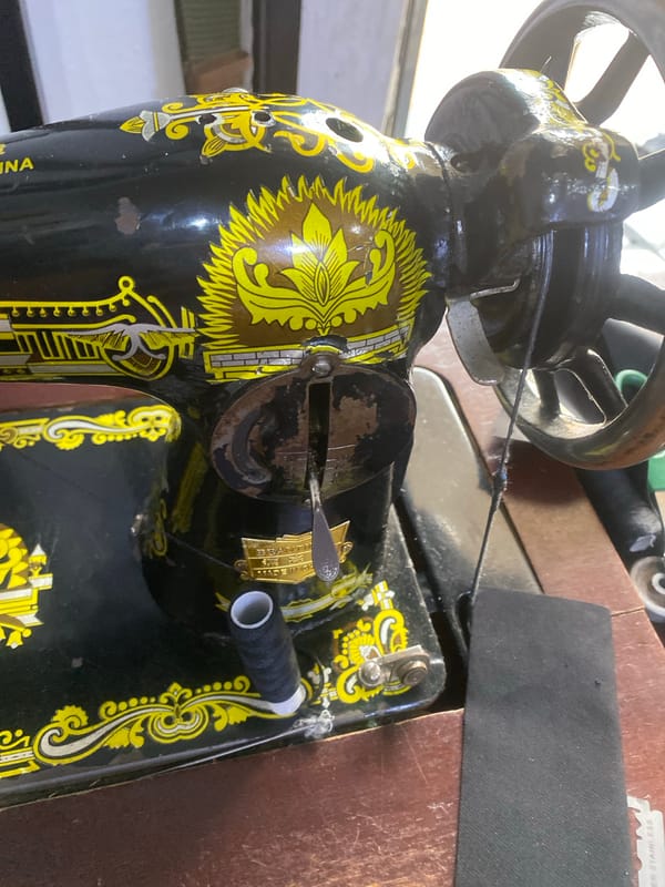 Inside a Jalingo sewing workshop, tools and fabric fill the afternoon