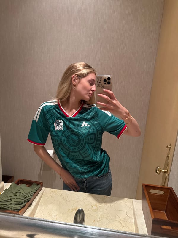 Woman in Mexico jersey takes selfies with dog companion