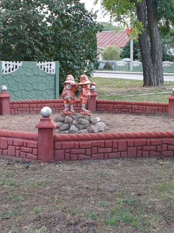 Gnome statues and moose topiary in a Kobryn garden