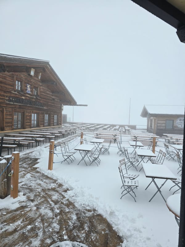 Snow-covered mountain restaurant observed in Garmisch-Partenkirchen during overcast conditions