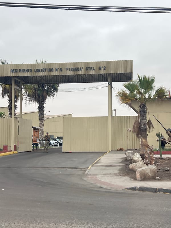 Street scenes captured near military facility and gas station in Arica