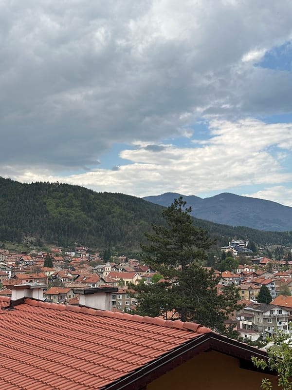 Cloudy afternoon views captured over Velingrad's red-roofed mountain townscape
