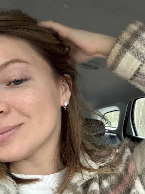Woman takes selfie in car in Niva, Russia
