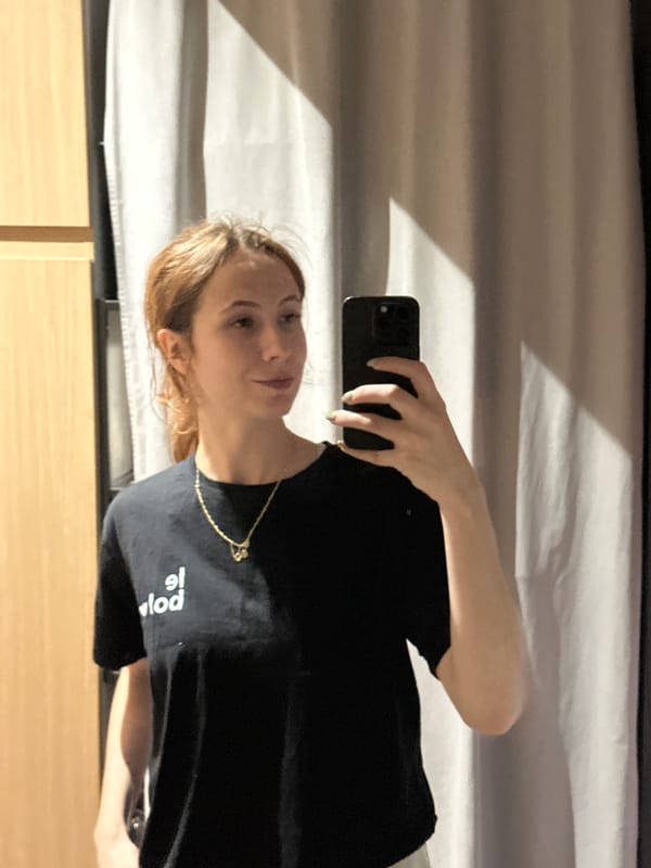 Woman takes selfies indoors in Novi Sad, Serbia