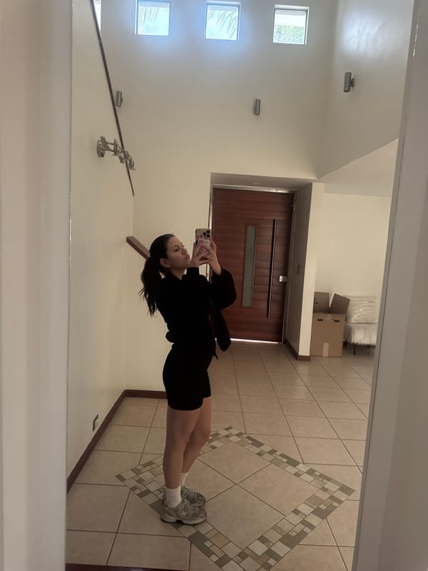 Woman takes mirror selfies at home in Puebla, Mexico