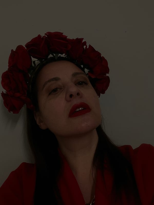 Woman in red rose crown photographed in Riga