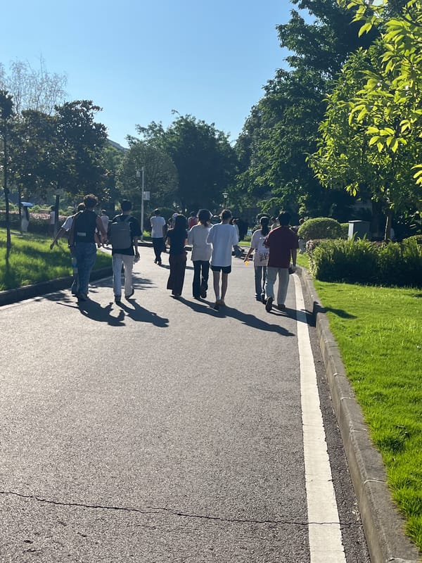 Weekday morning foot traffic across a Jiangjin university campus