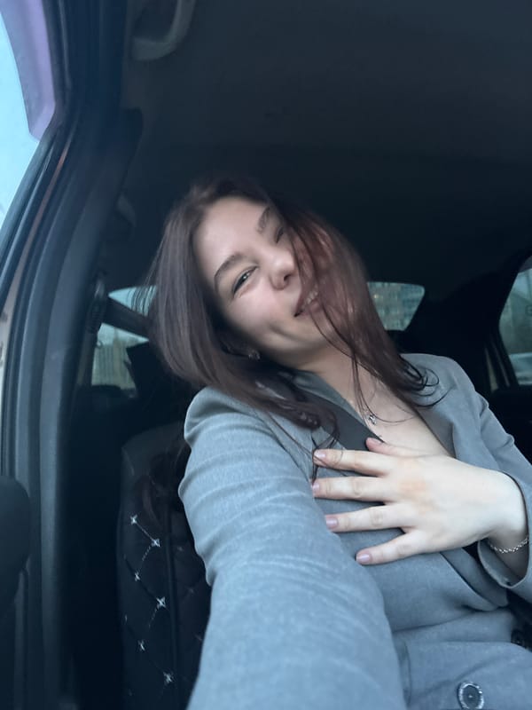 Woman takes selfie in car in Perm, Russia