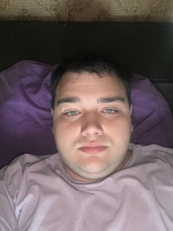 Lazy morning selfie session on a purple pillow