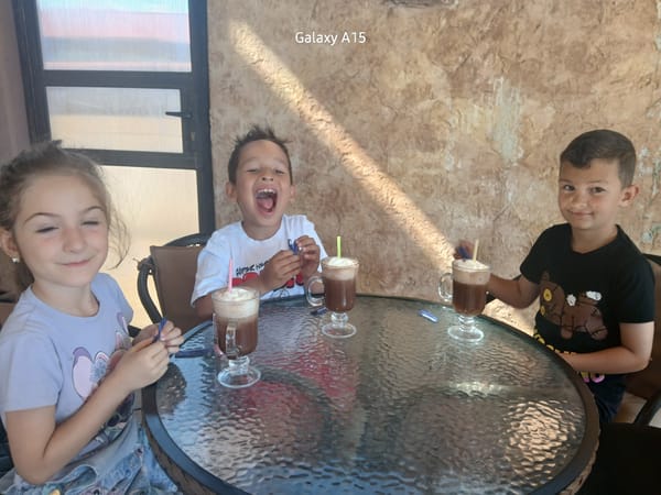 Children share morning drinks at Bulgaria cafe