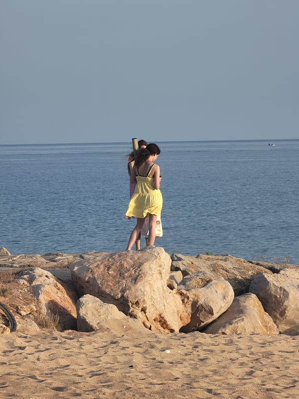 Golden hour on the Quarteira waterfront, beach to boardwalk