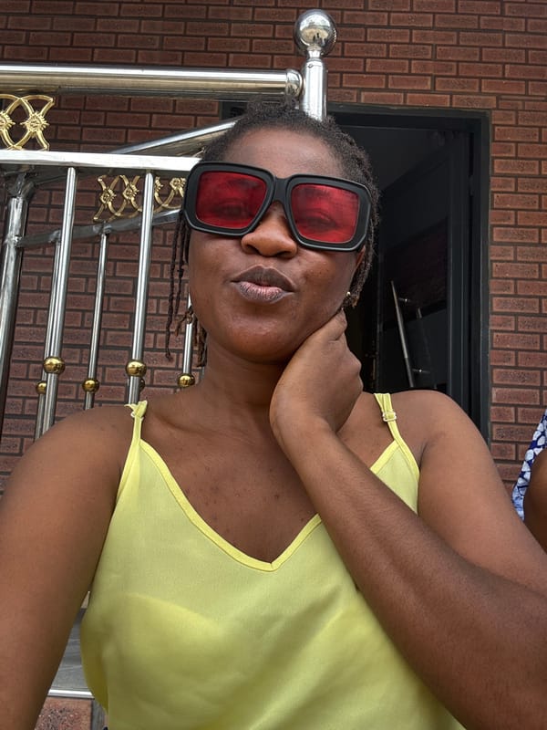 Selfie session outside a brick building in Ajara, Nigeria
