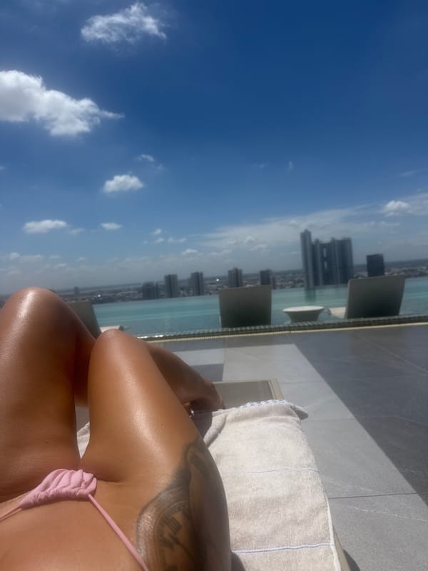 Rooftop pool lounging with Phnom Penh skyline views