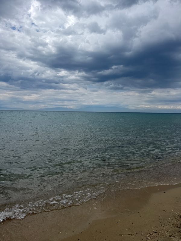 Storm clouds gather over empty beach resort