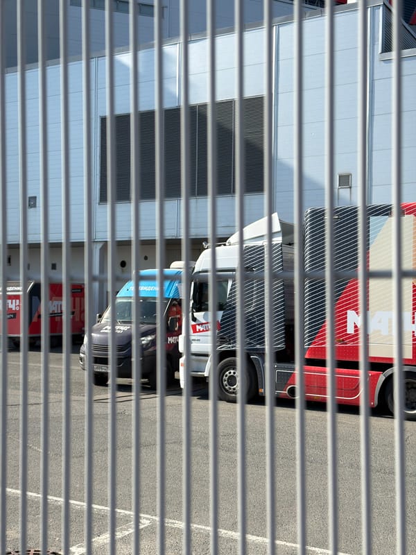 Street scenes captured in Kazan show trucks, sports banners