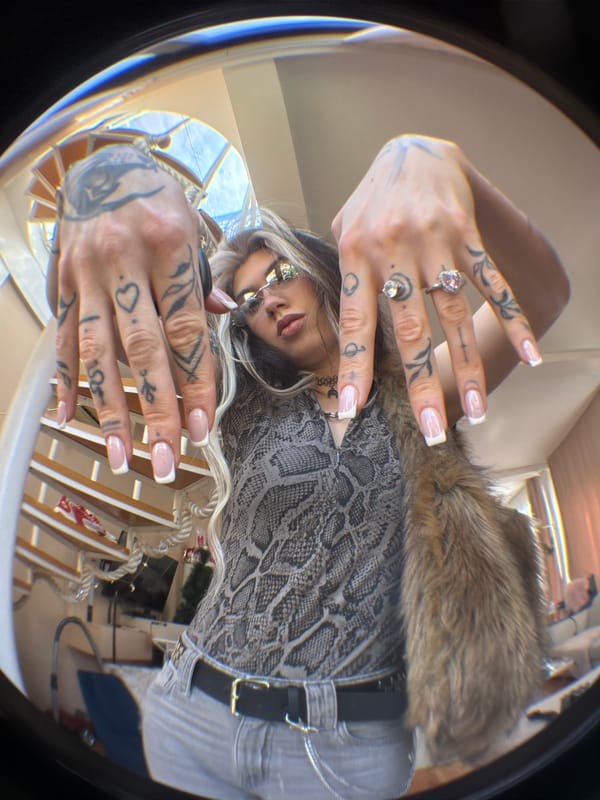 Woman takes fisheye selfies indoors in Budva Montenegro