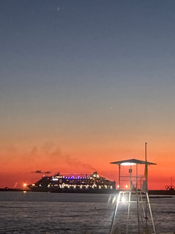 Cruise ship lights up Sochi waterfront at sunset