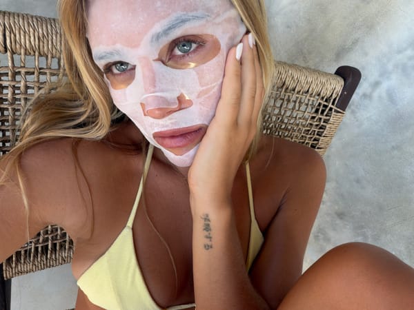 Woman relaxes in wicker chair in Kuta Selatan