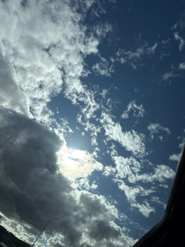 Highway journey documented through sky and road views