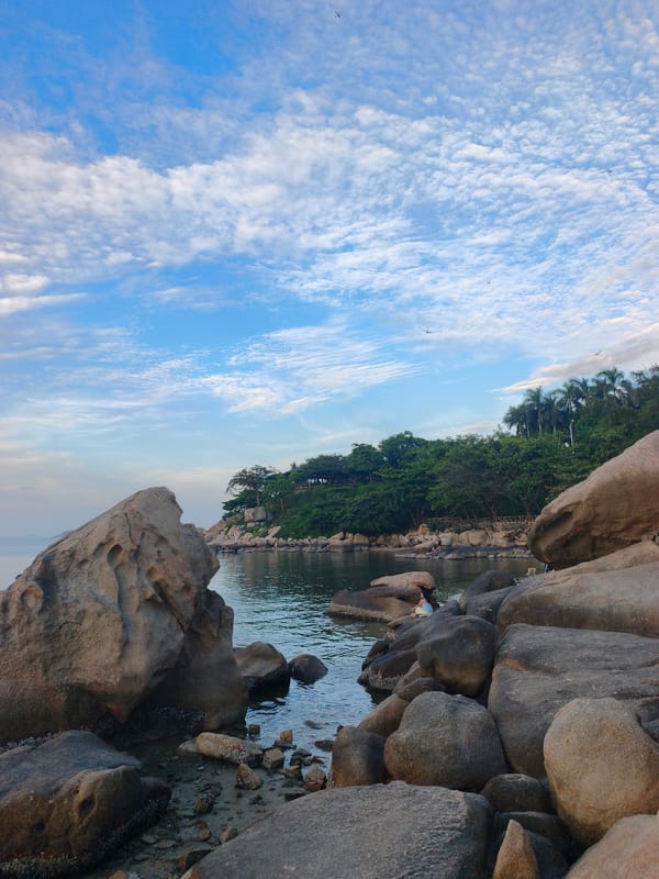 Nha Trang's rocky coastline and beachfront on a July morning