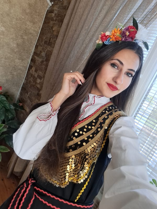 Traditional Bulgarian folk costume photographed and displayed indoors