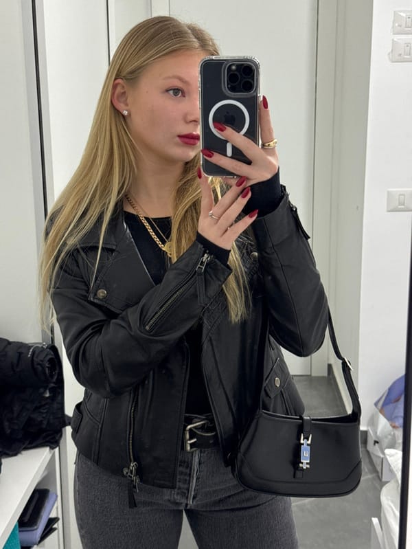 Woman Takes Selfie in Black Leather Jacket in Ariel
