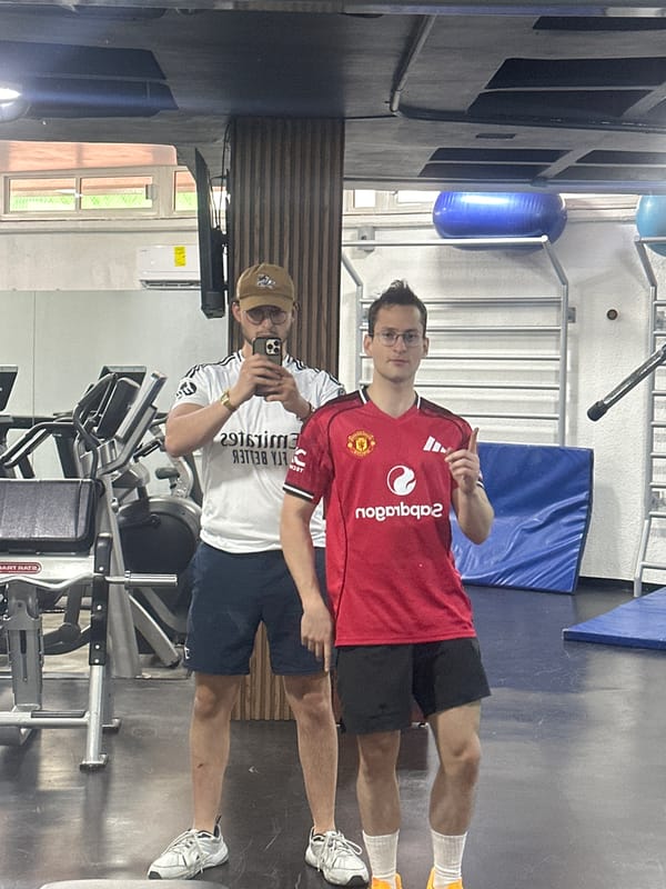 Two men take gym selfie in soccer jerseys