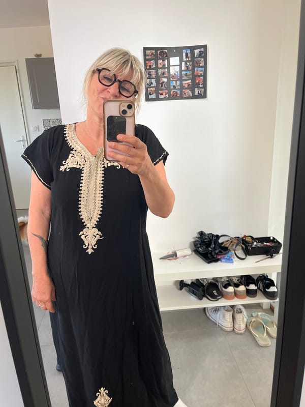 Woman takes mirror selfie in ornate dress in Chambœuf