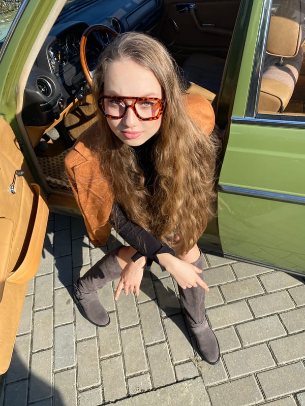 Young adults pose with vintage green Mercedes in Yekaterinburg photoshoot