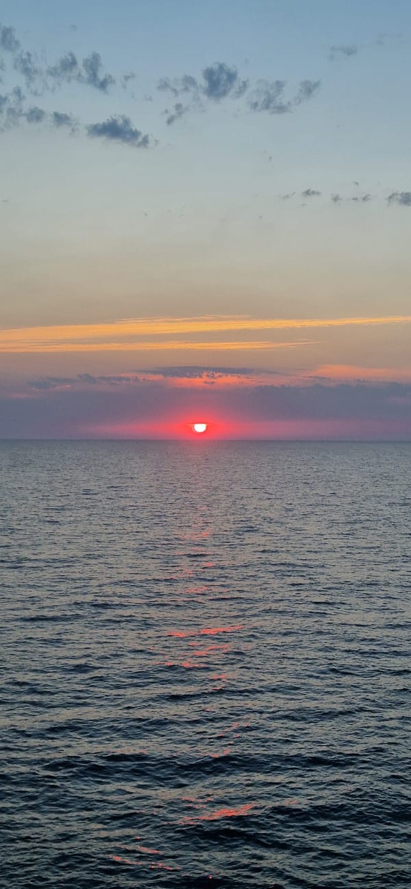 Red sunset melts into the Ionian Sea off Corfu