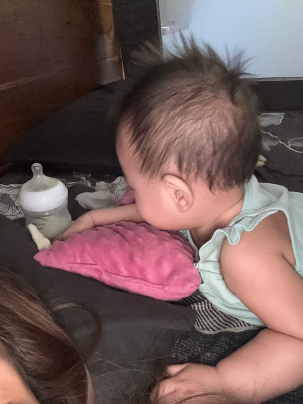 Baby's morning in bed: naps, tummy time, and tablet cartoons