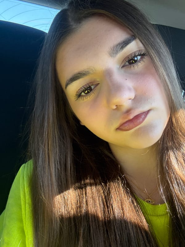 Woman's morning routine documented in car near apartment buildings