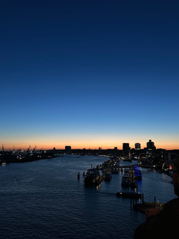 Twilight cityscape captured along Hamburg waterfront Tuesday evening