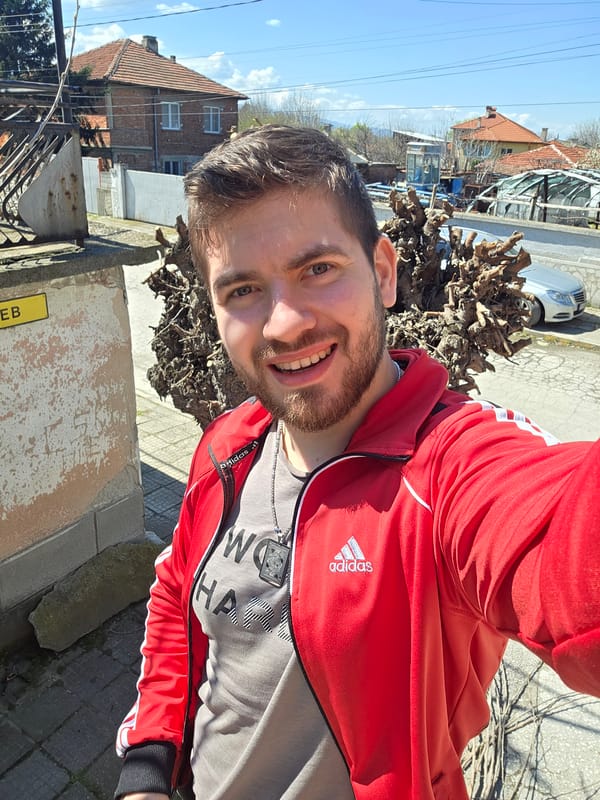 Man in red Adidas jacket takes selfies in Yagodovo