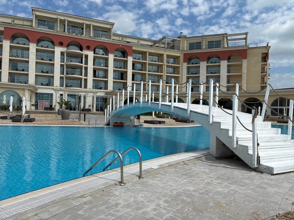 Woman takes morning selfie at Bulgarian resort pool