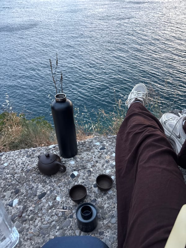 Storm rolls in over Budva at dusk from a clifftop perch