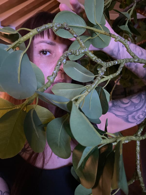 Woman takes selfies in decorated indoor space in Votkinsk