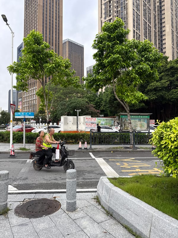 Haizhu District's modern streetscape on a cloudy afternoon