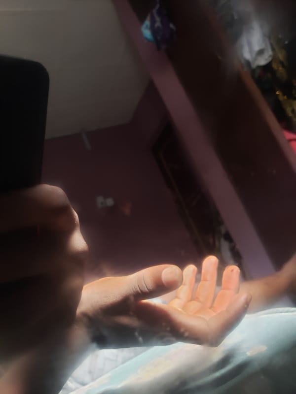 Hand and worn sneaker detail shots, Iganmu, Nigeria