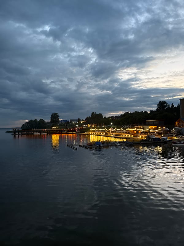 Dusk at the Votkinsk waterfront, clouds and calm water