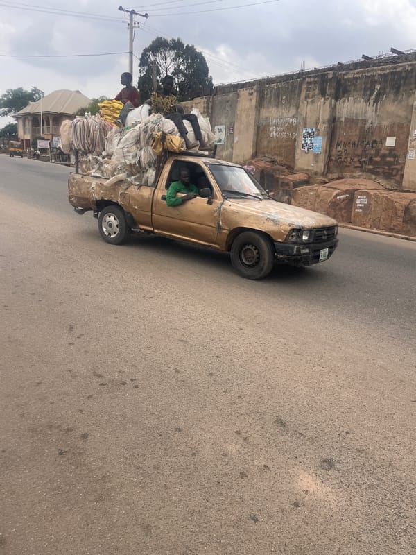 Overloaded pickup truck carries sacks, passengers in Jos